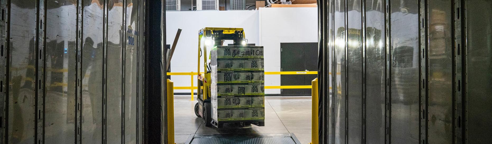 A Forklift Delivering Signet's Pallet Shipping Materials