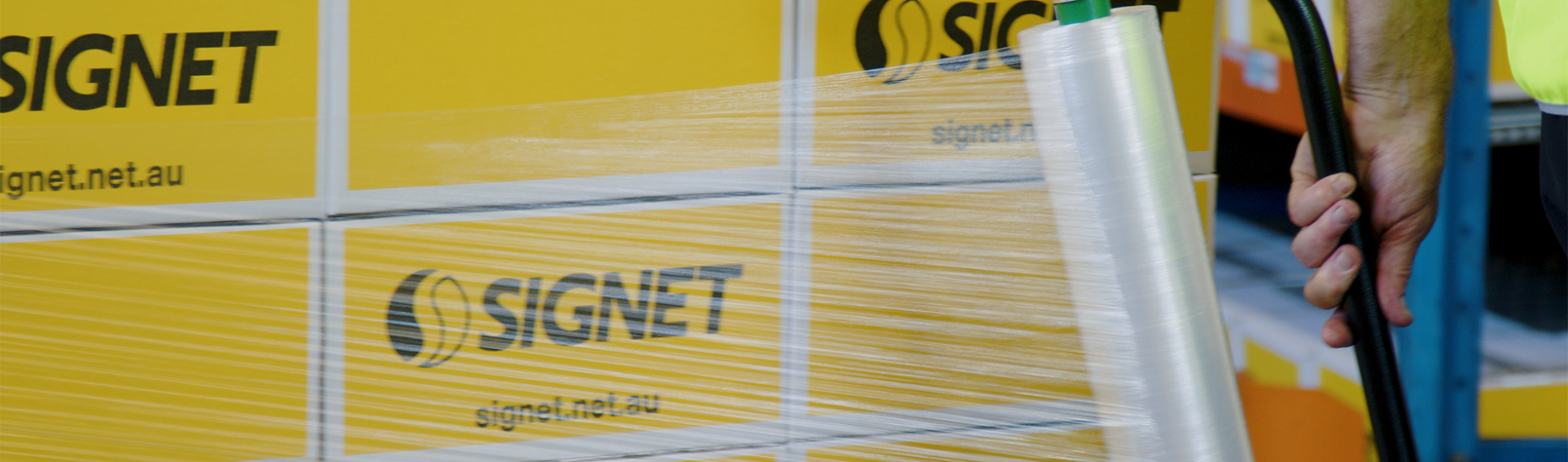 Hand Stretch Film being wrapped around pallet