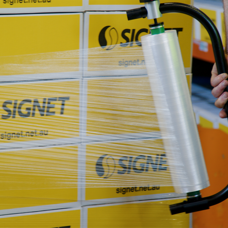 Hand Stretch Film being wrapped around pallet