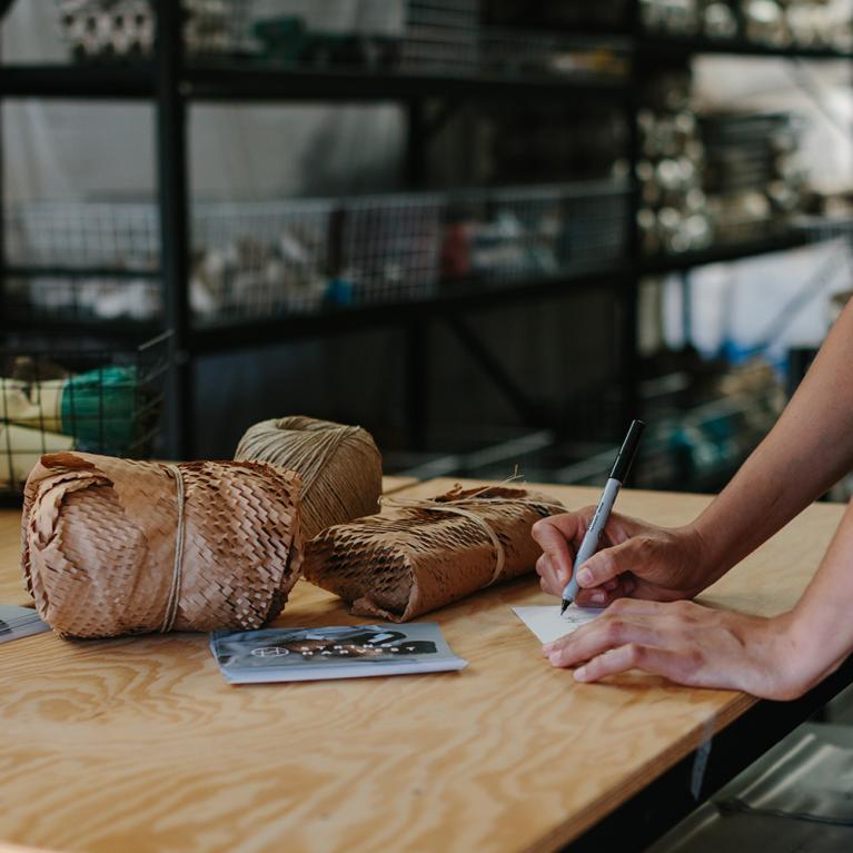 Lady writing on thank you card