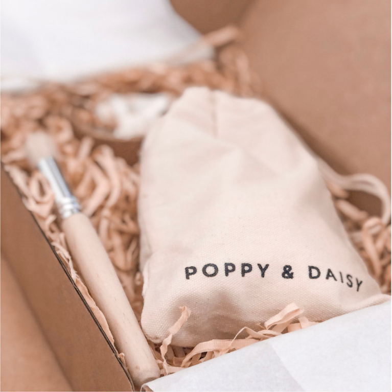Poppy & Daisy products on table