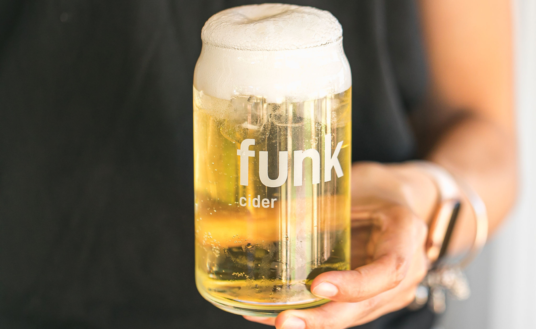 Cider being poured into funk glass