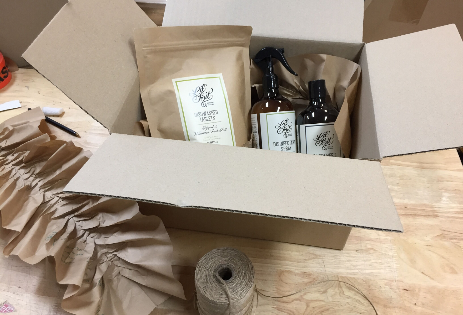 Lil' Bit Products in shipping carton with kraft paper