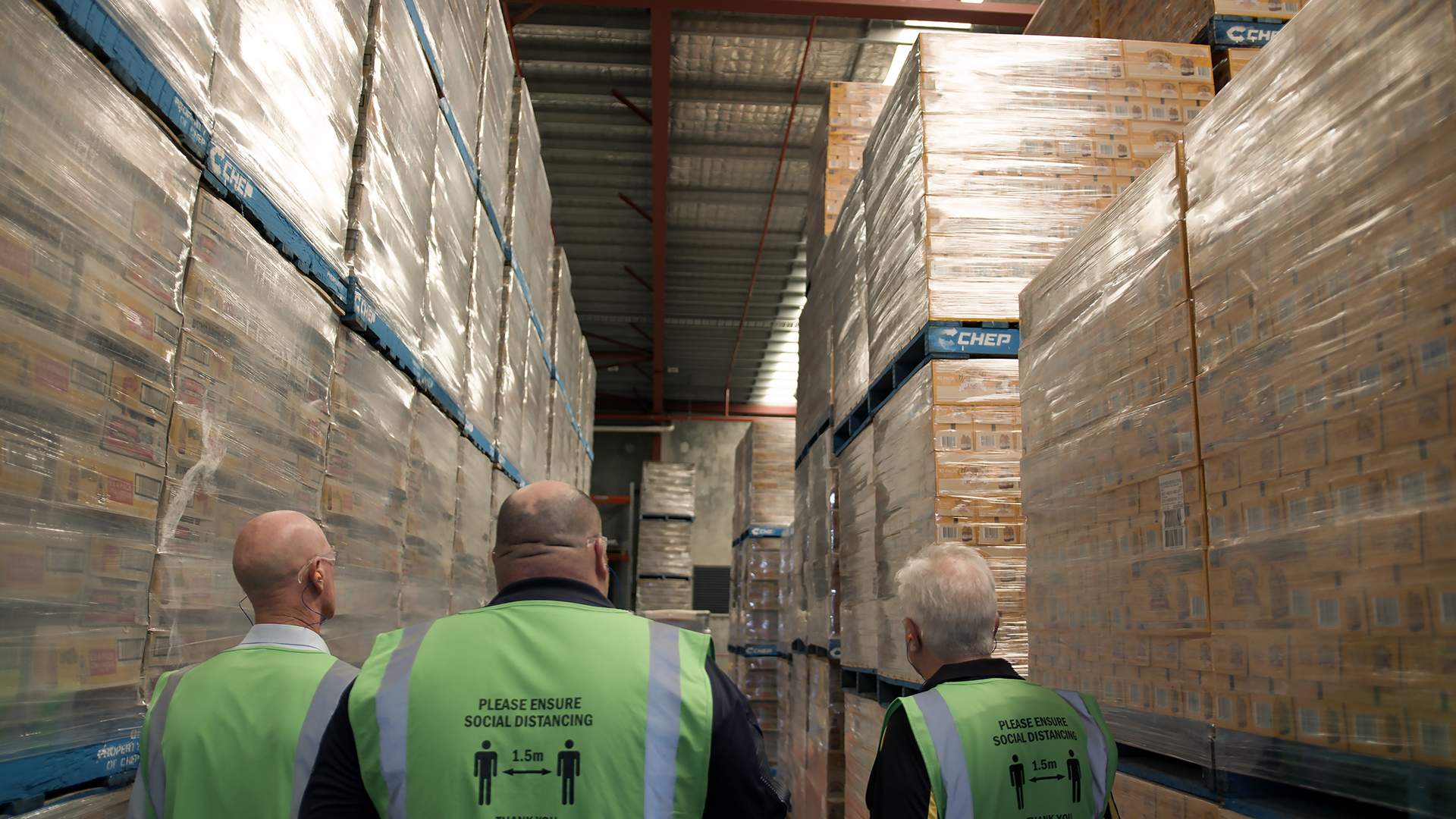 Individual Inspecting Goods Packaged Using Pallet Shipping Material