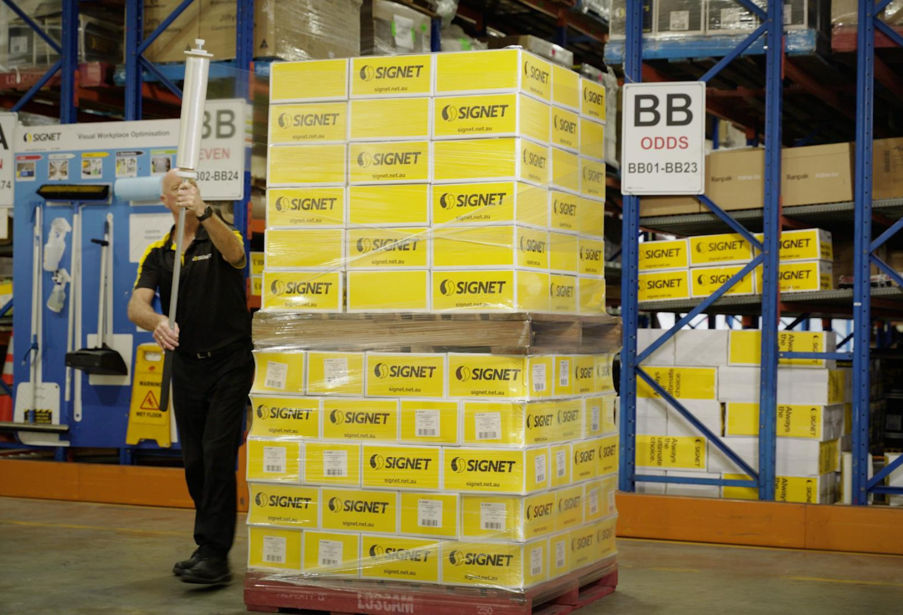 Person wrapping a pallet with the Nelson Pallet Wrapper