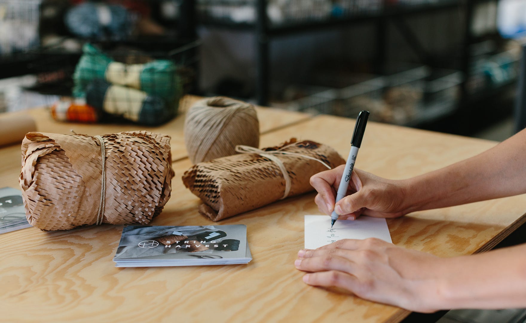 Lady writing on thank you card