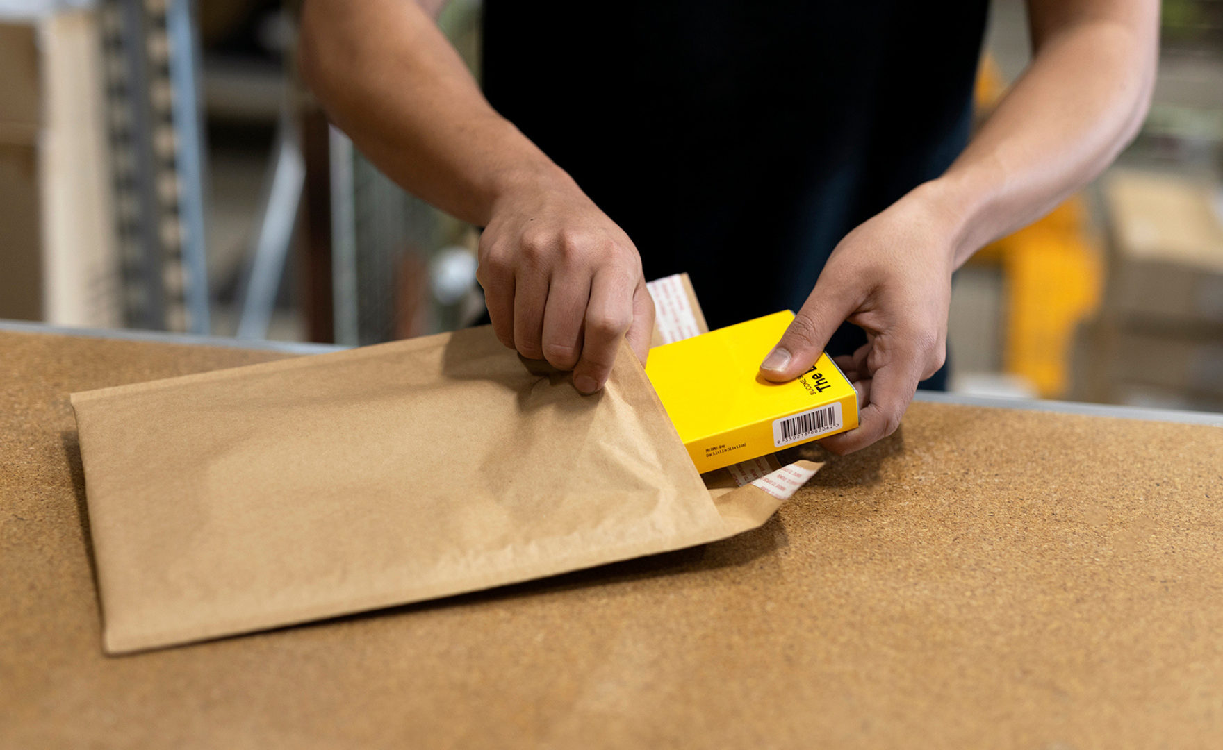 Tooletries worker packing products into Honeycomb Mailer