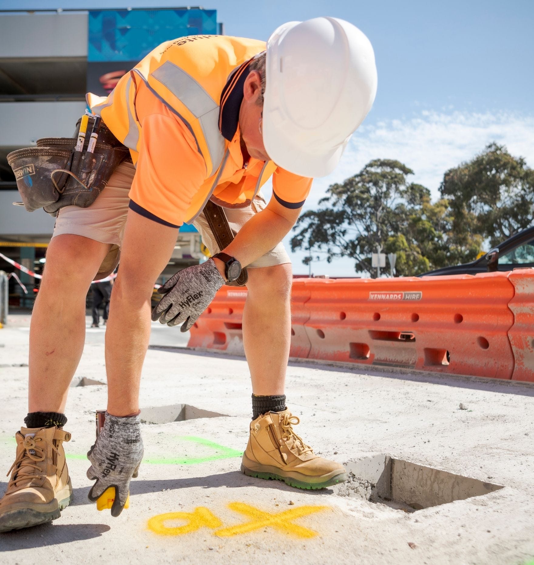 Spraying spot marking paint on concrete