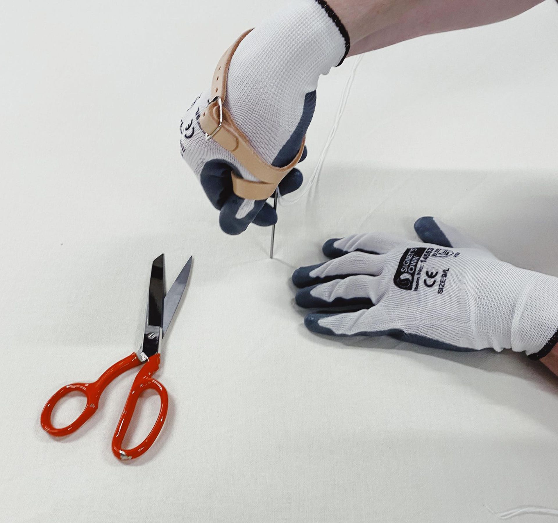 Tufting a mattress with Signet's Own Foam Nitrile Gloves