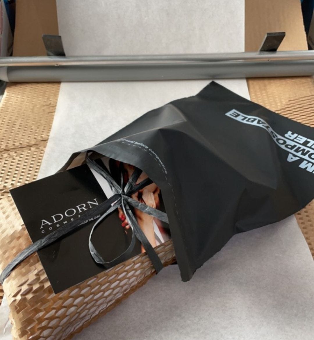 Adorn Cosmetics items packaged in a Signet Compostable Mailer